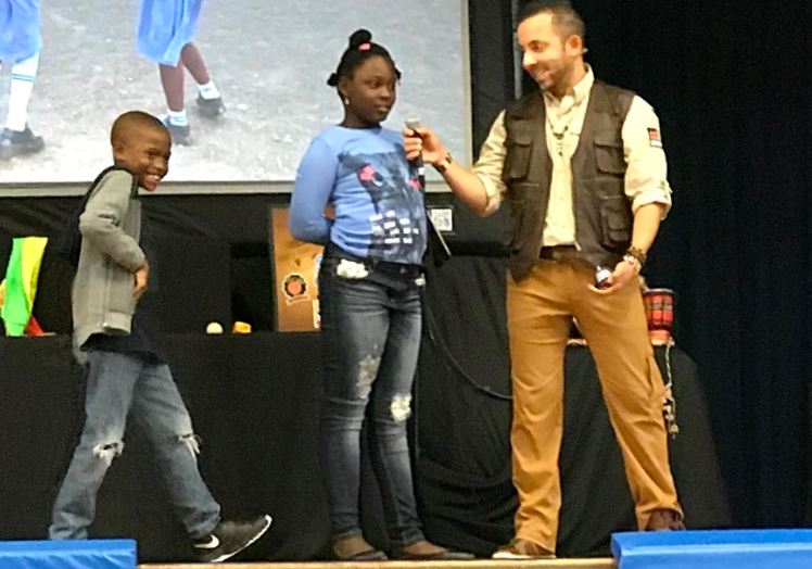 Two student volunteers speaking about kindness.