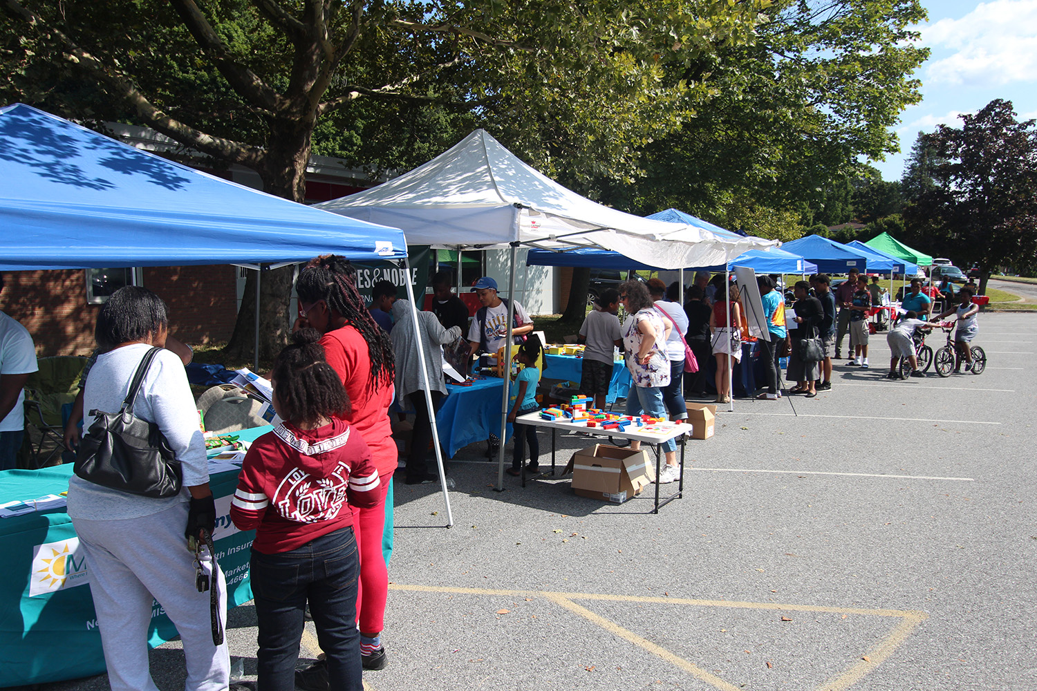 Vendors lined the outdoor area and talk to attendees after event.