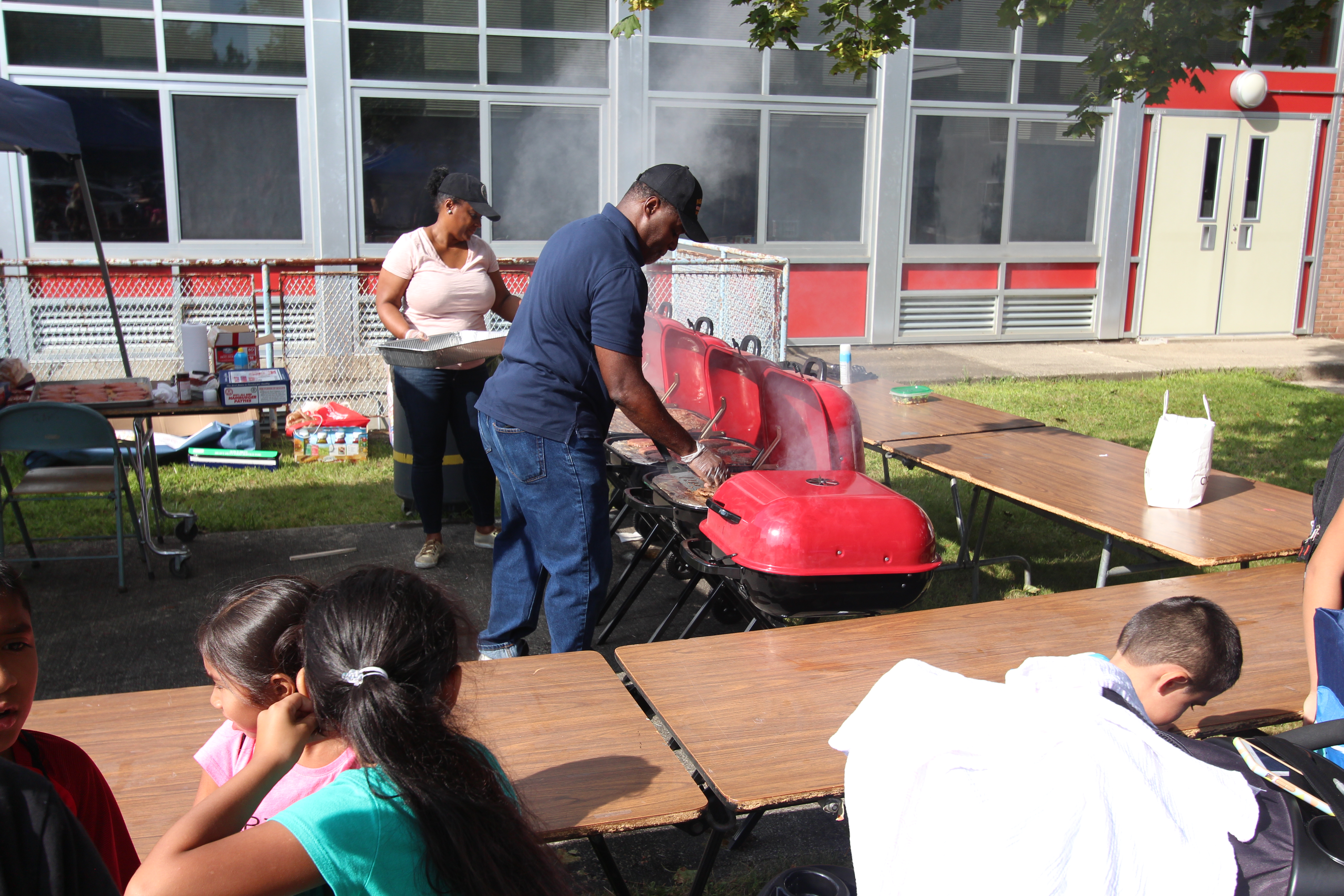 Volunteers BBQ for the attendees