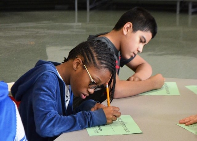 Two students writing