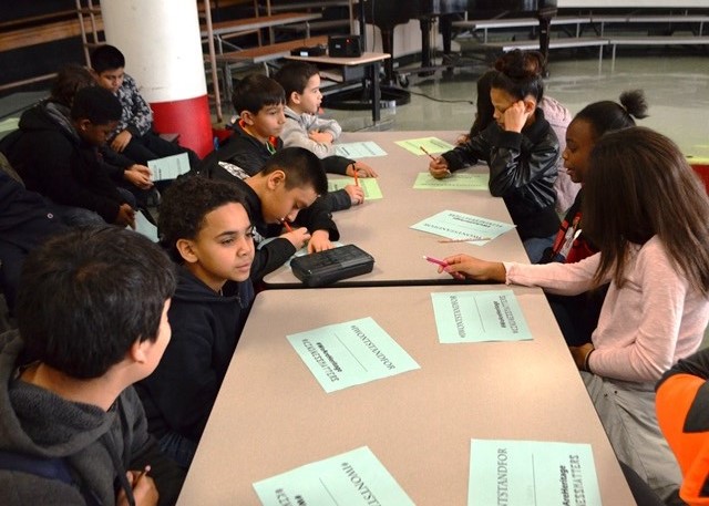 A group of students writing