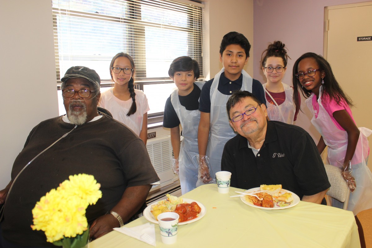 Group photo of residents and students.