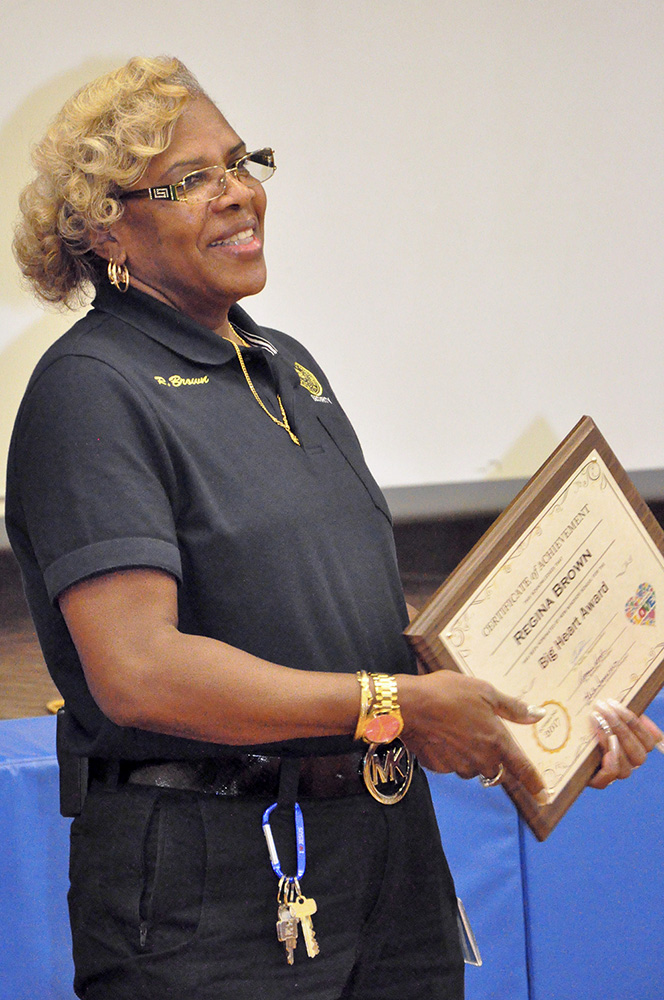 Security Guard Regina Brown with award