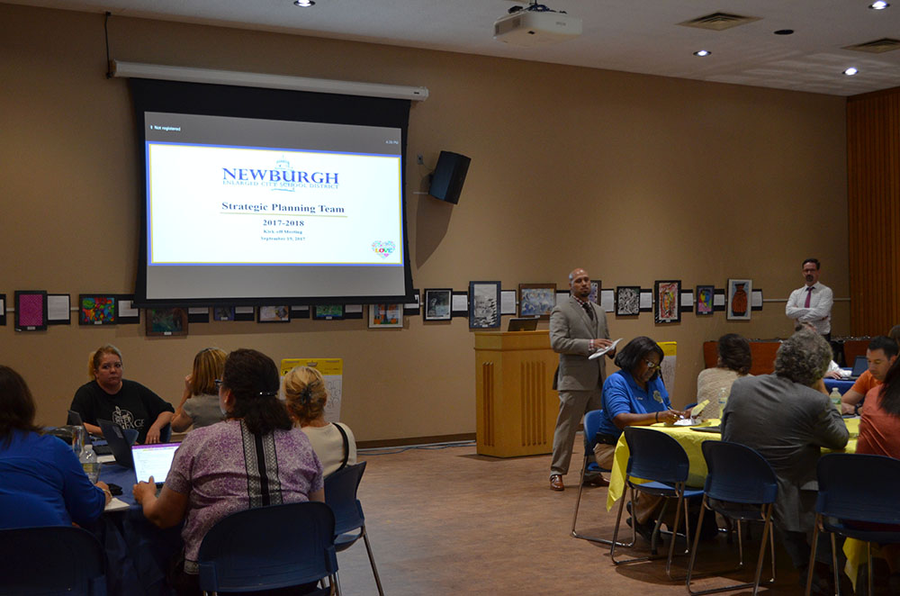 Members of the Strategic Planning Team discuss this year's focus. Photo 3