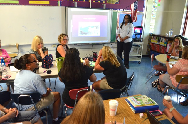 Administrators discussing the opening of Vails Gate Steam Academy