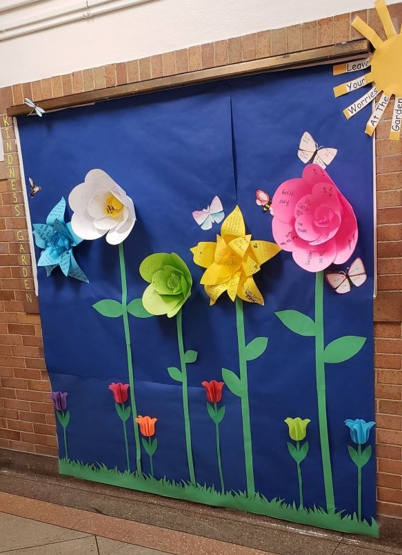 Bulletin board depicting a floral scene.