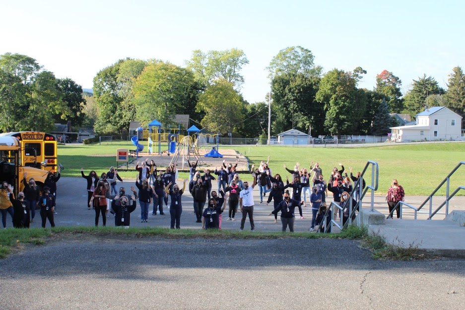 Faculty and staff who donated to the drive posed for a socially distanced photo.