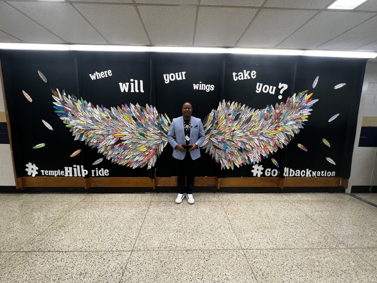 Phil Howard with Wing Mural