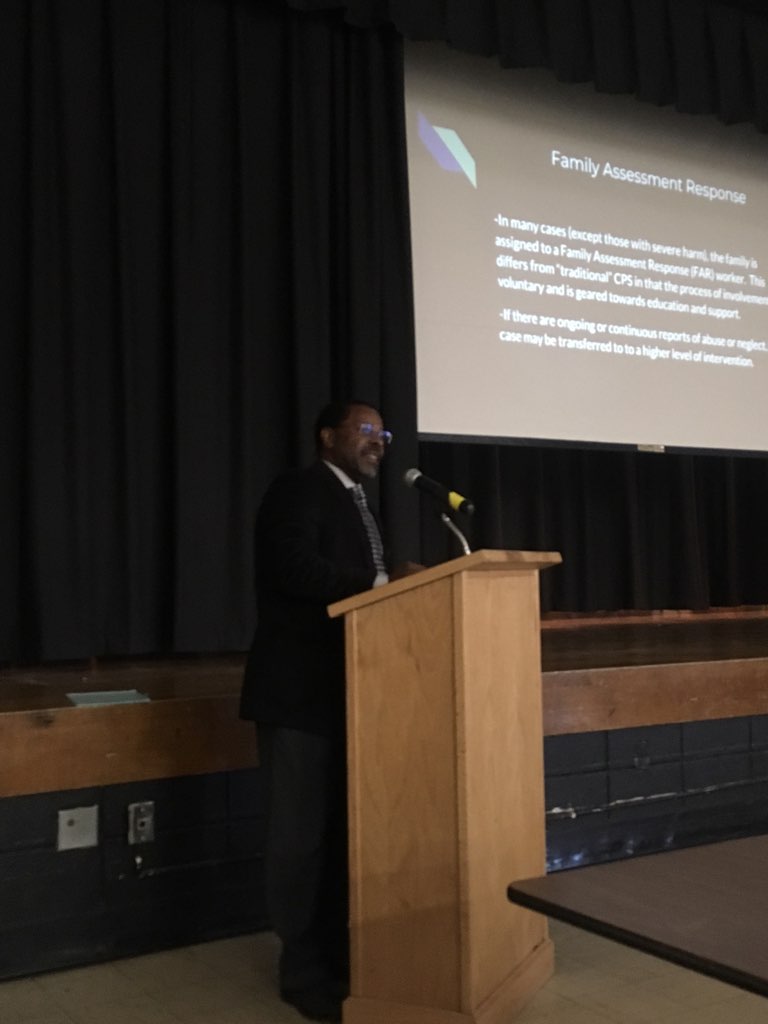 Assistant Superintendent for Human Resources, Mr. Michael McLymore presents the trophy