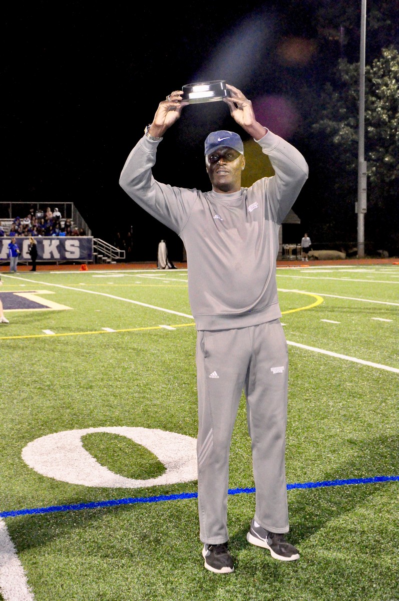 Coach Malcolm Burks honored as Boy’s Track and Field Coach of the Year at a football game