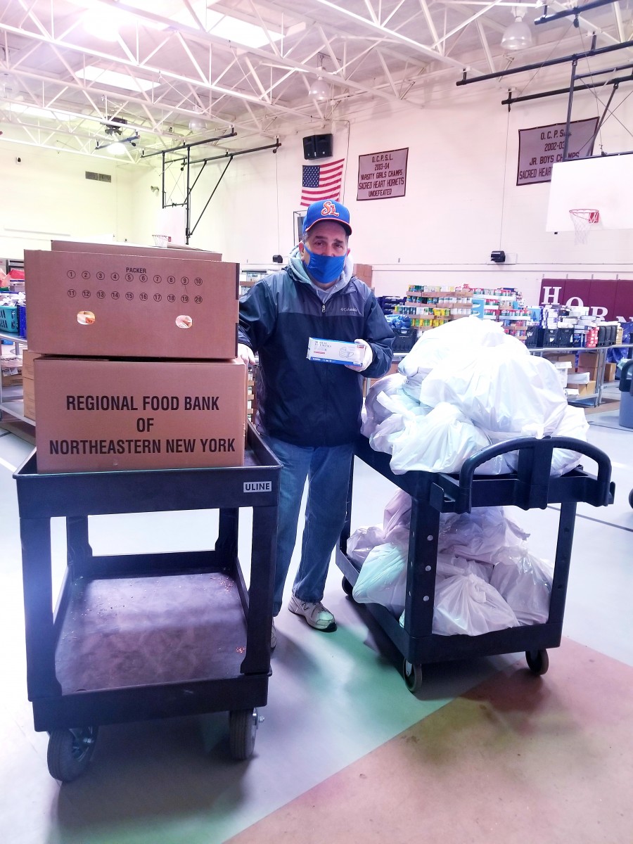 Deacon Jack Seymour Food Pantry volunteer who packed the bags with the food for our district scholars and helped in loading up the bags to be delivered to the District Families residing at CHI.