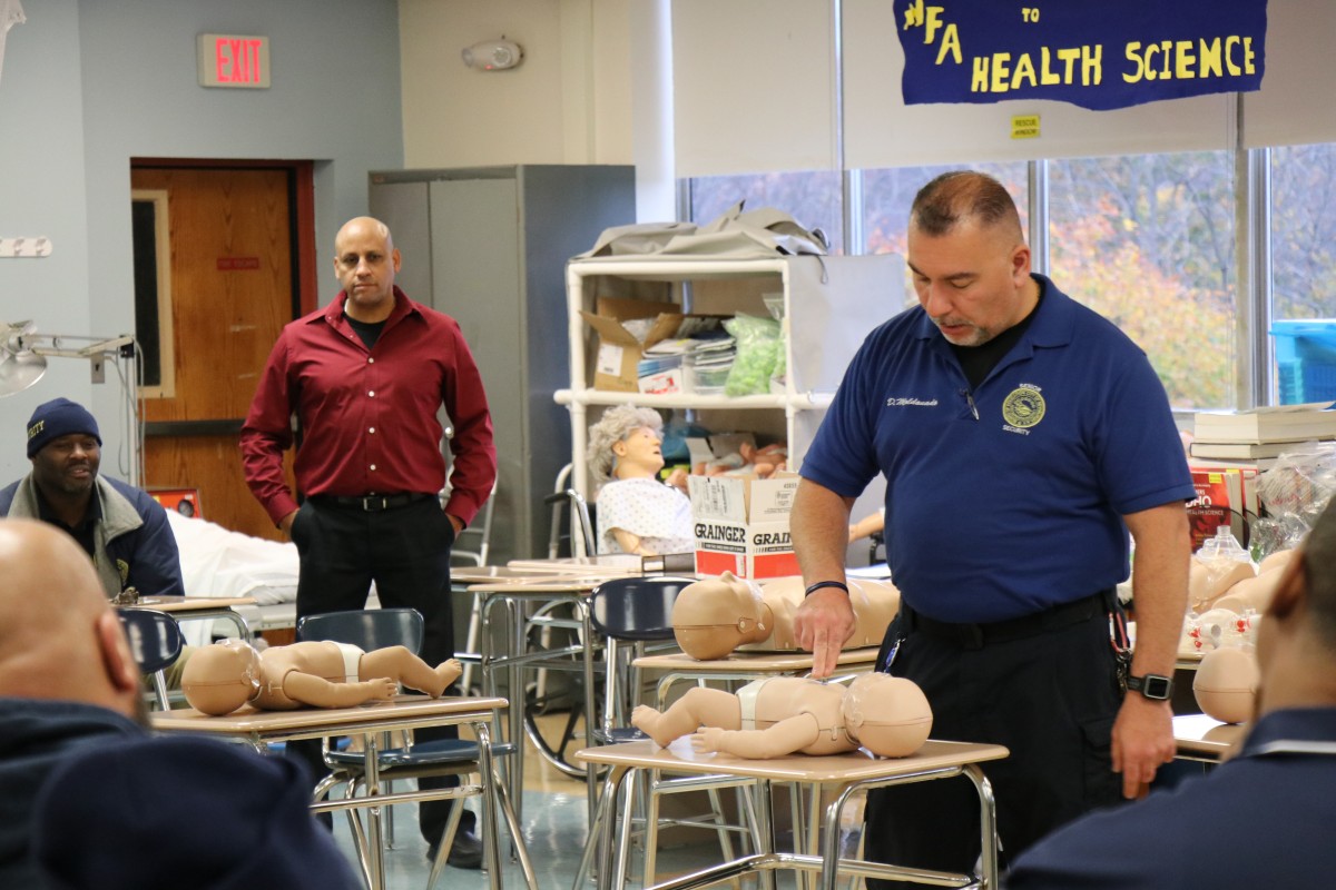 Senior school monitor, Mr. David Maldonado instructs security guards on technique.