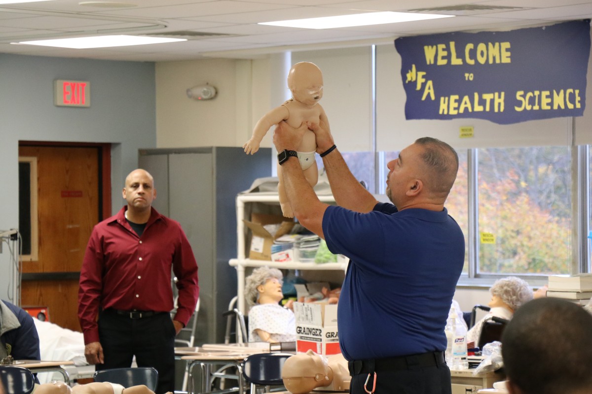 Senior school monitor, Mr. David Maldonado instructs security guards on technique.