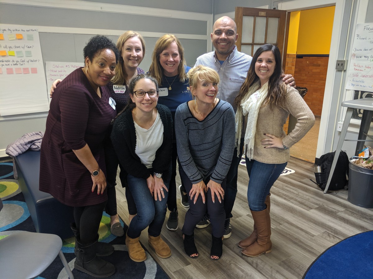 Group of ITFs, administrators and presenters pose for a photo.