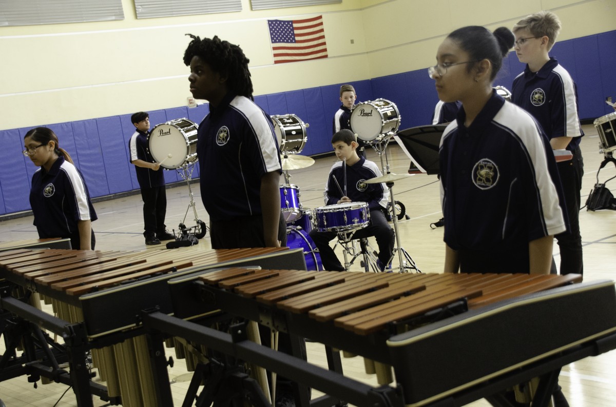 Students performing in the Drumline.