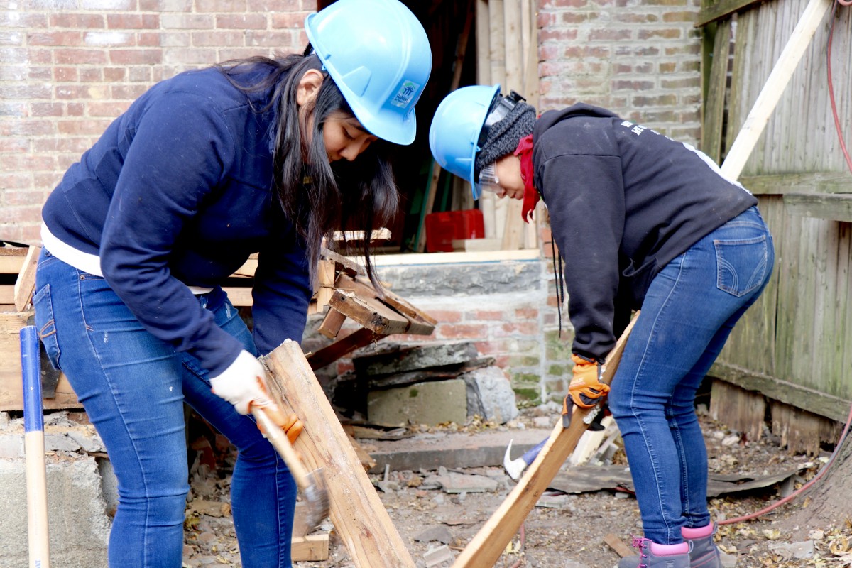 Students hammer nails