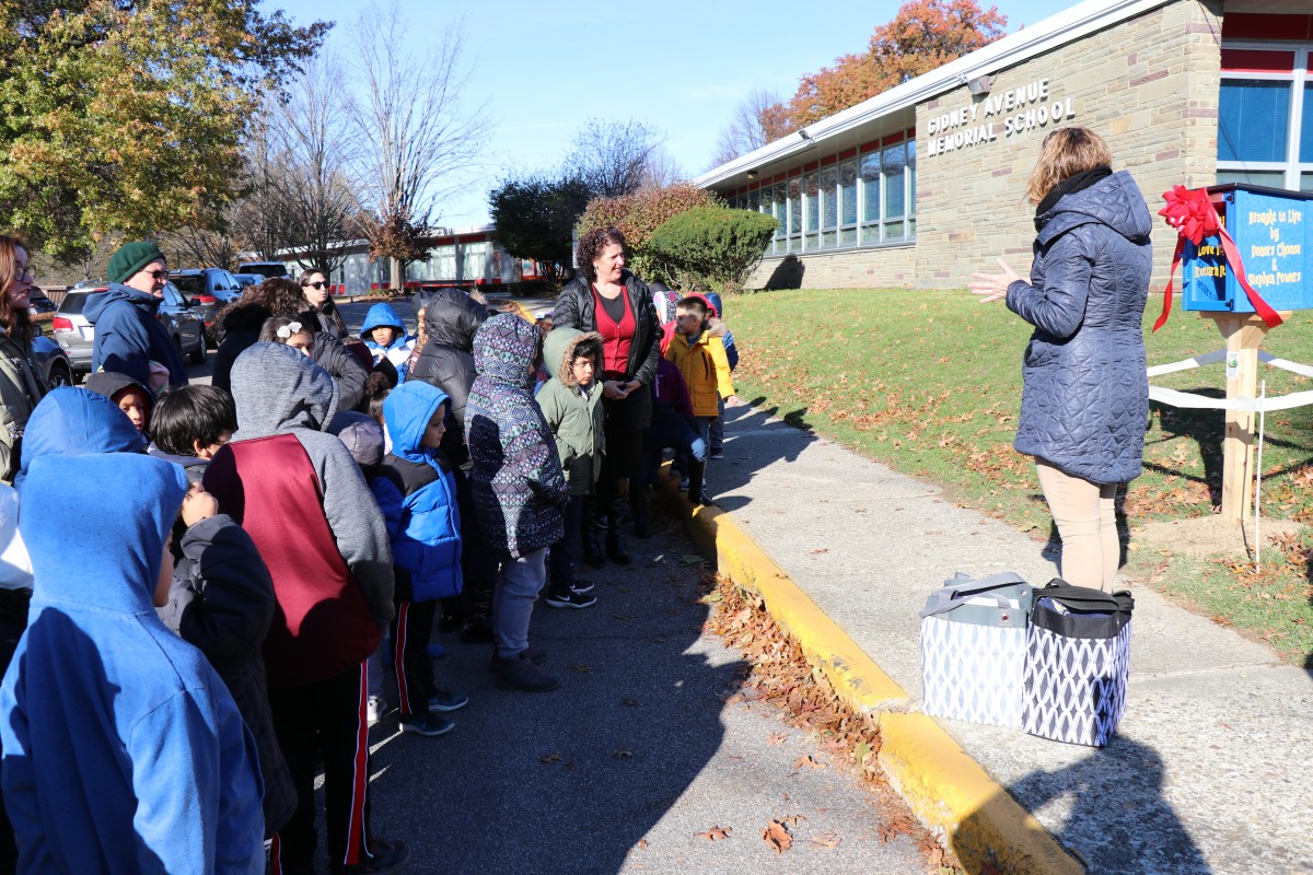 Students gathered around for the ribbon cutting.