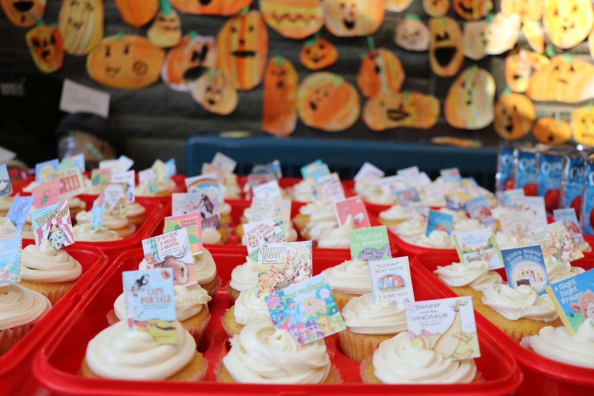 Cupcakes with book cover decorations.