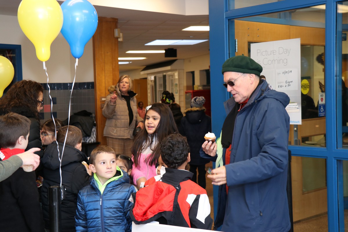 Mr. Powers chats with a student at the celebration.