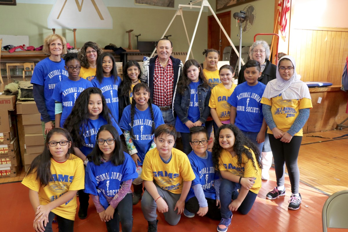 Group of students pose with Assemblyman Skartados