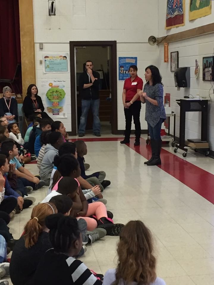 Picture shows, GLA School Nurse Teacher and lead on campaign, Ms. Hill speaking to the students (wearing grey)