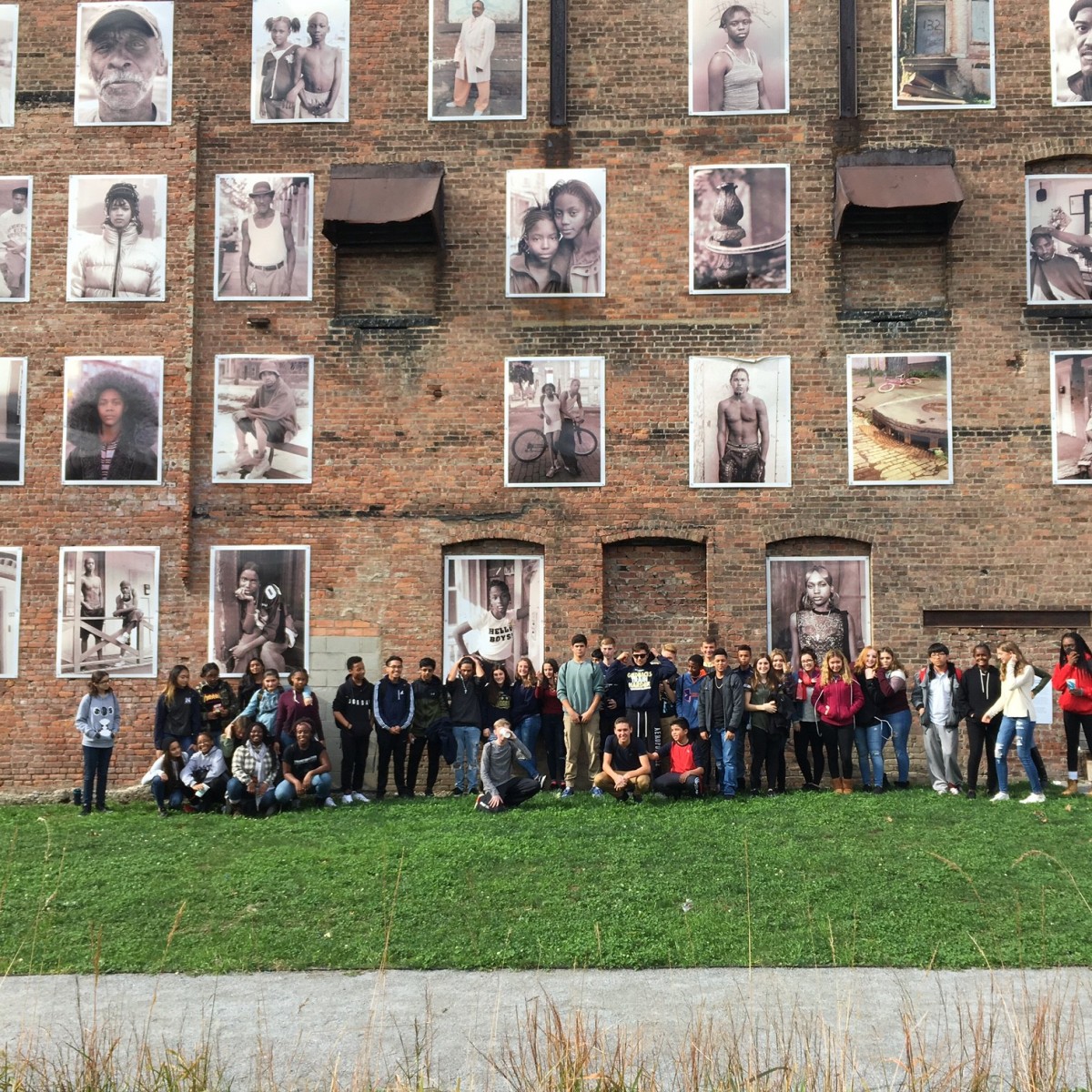 Freshman in front of Safe Harbors