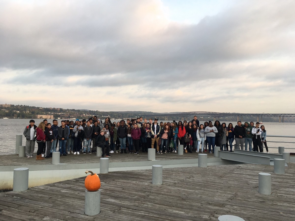 83 NFA Students pose at Beacon's Long Dock with Newburgh positioned behind them