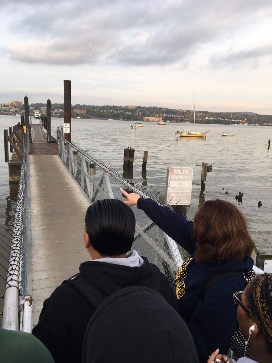 Mrs. Sileno points to incoming ferry