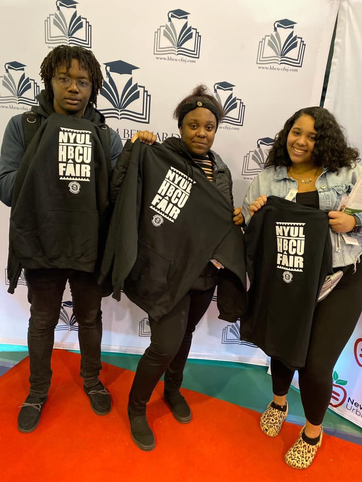 Students pose with fair t-shirts.