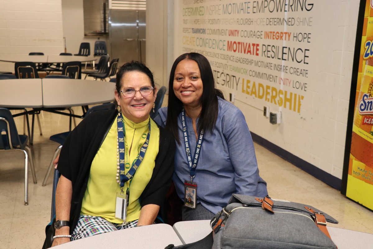 Mentor and mentee pose for a photo.