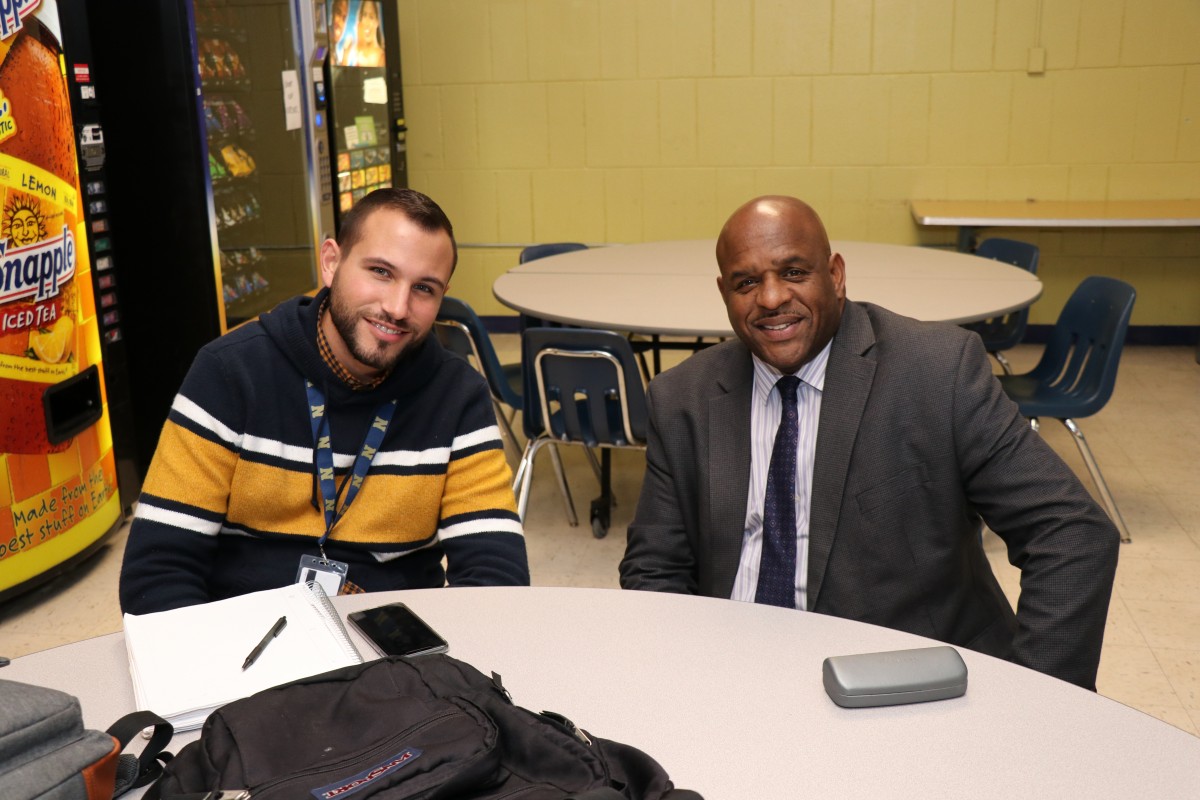 Mentor and mentee pose for a photo.