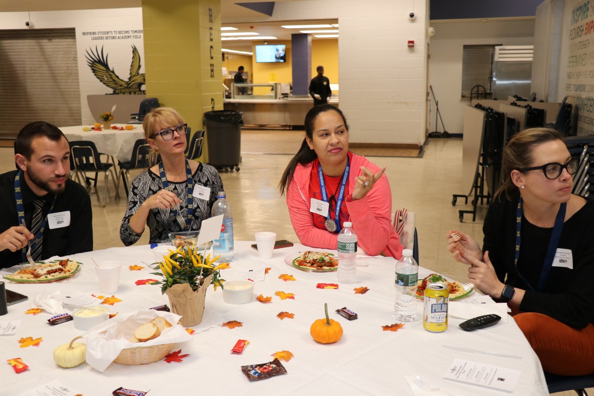 New employees discuss the order of the mantras.