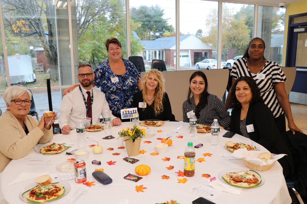 Members from the Department of Human Resources and Mr. John Etri pose for a photo.