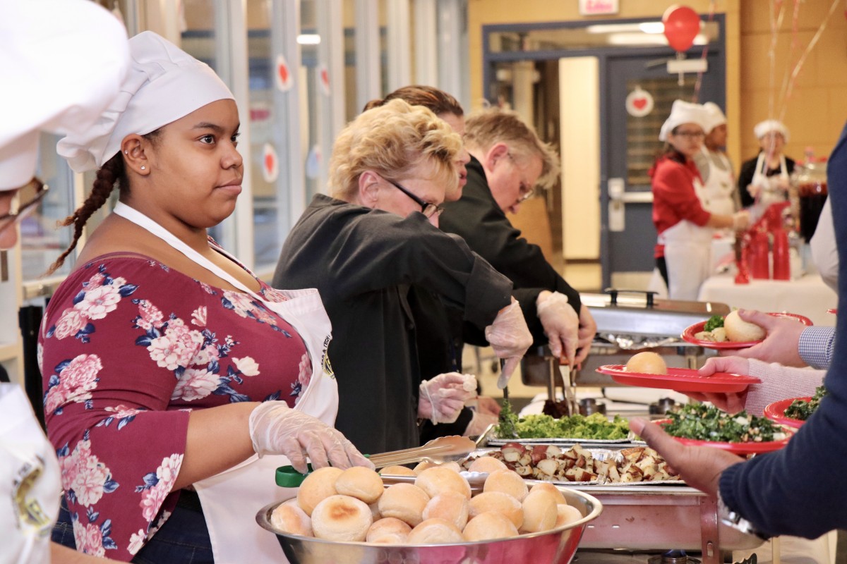 Culinary Scholars serve the meal