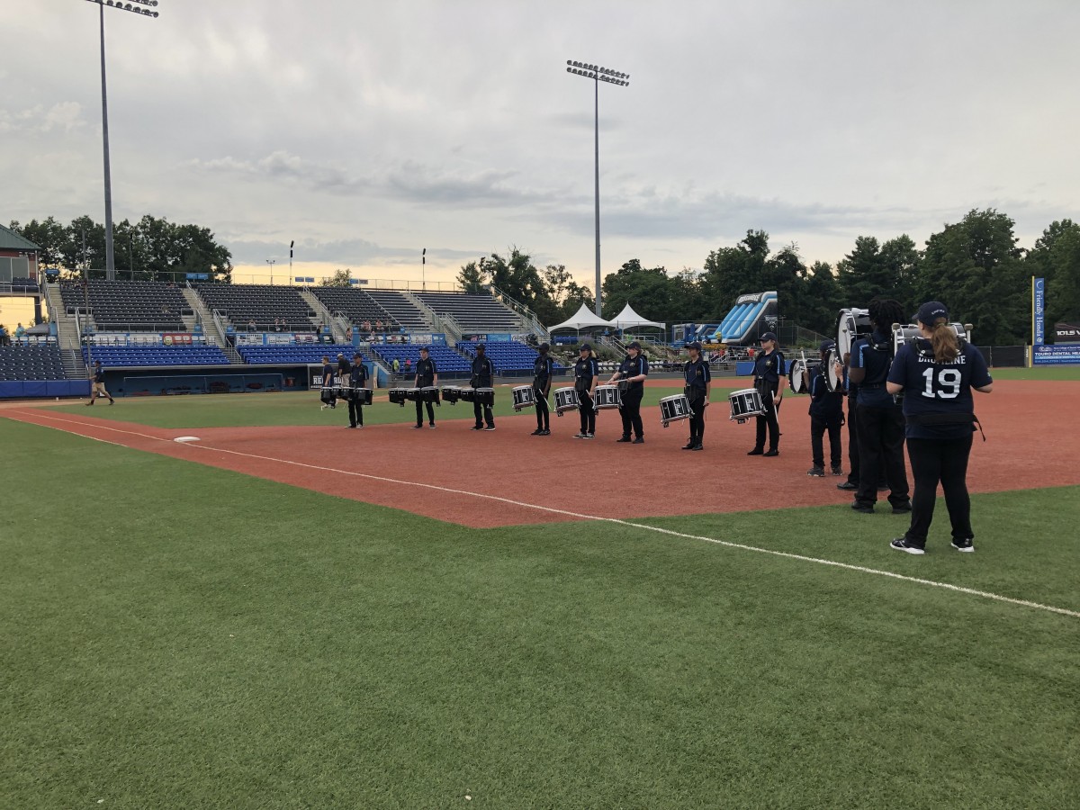 Drumline performs on field.