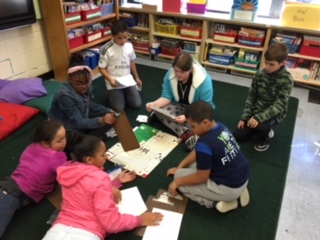 Students in Ms. Hoffman's class share their math games with students from Mrs. St. Clair's class.