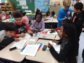 Students in Ms. Hoffman's class share their math games with students from Mrs. St. Clair's class.