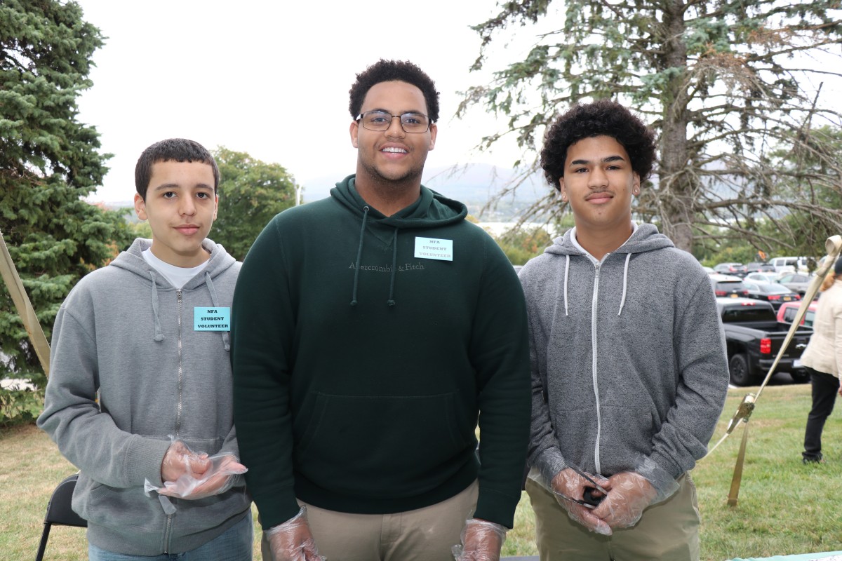 Students pose for a photo at their booth.