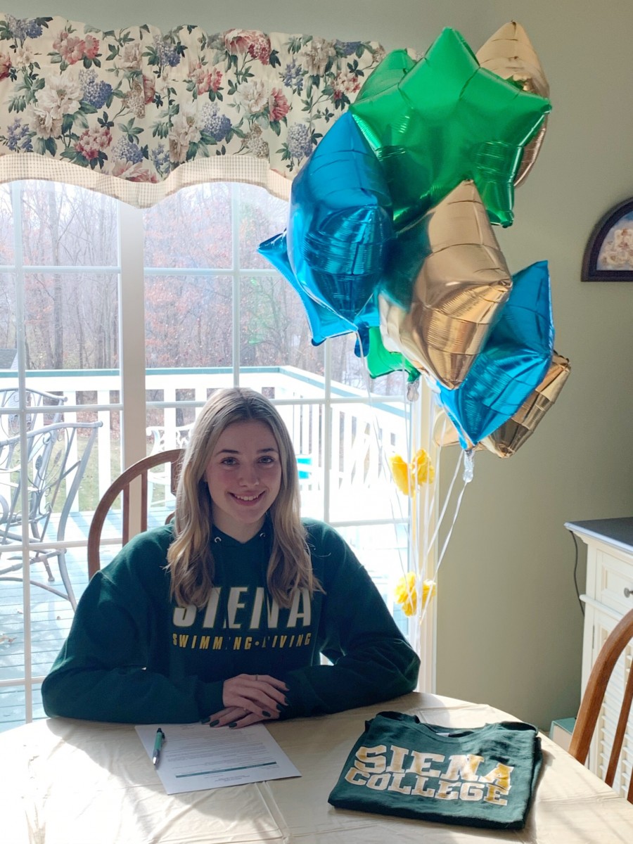 Shaylea Triller poses for a photo after signing her National Letter of Intent.