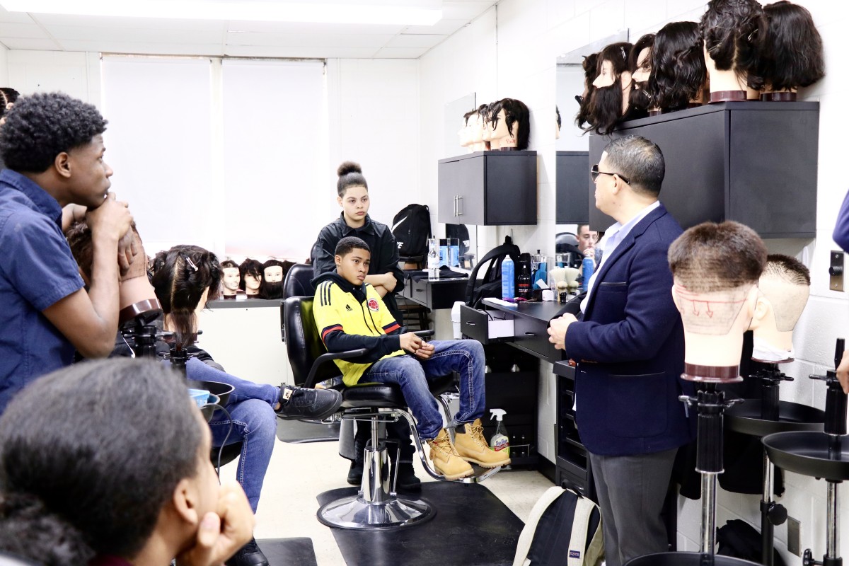 Guest barber presents to barbering students