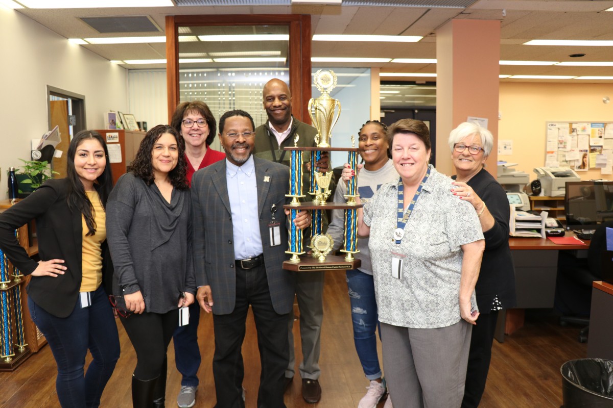 The Human Resources Department poses with their trophy.