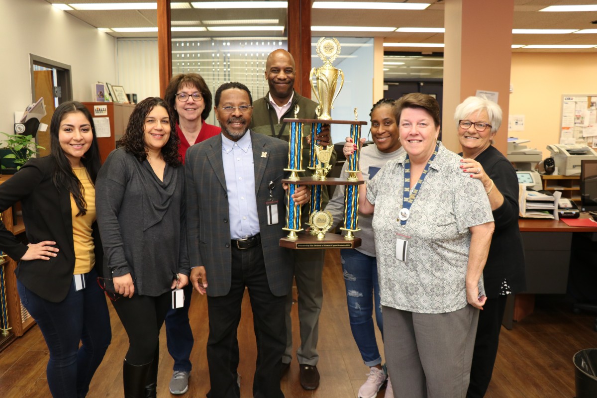 The Human Resources Department poses with their trophy.