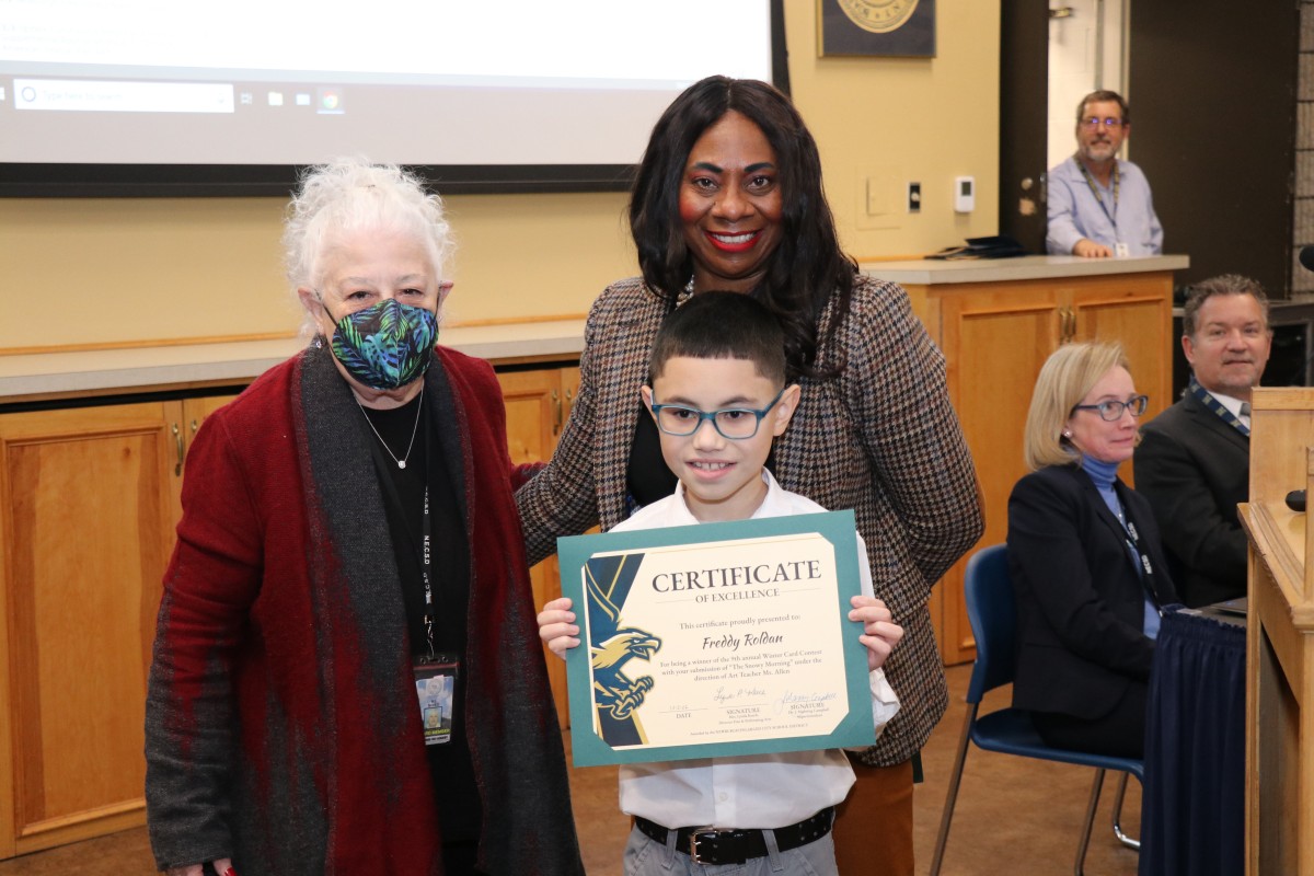 Freddy Roldan poses for a photo with BOE President, Ms. Carole Mineo and NECSD Superintendent, Dr. Manning Campbell.