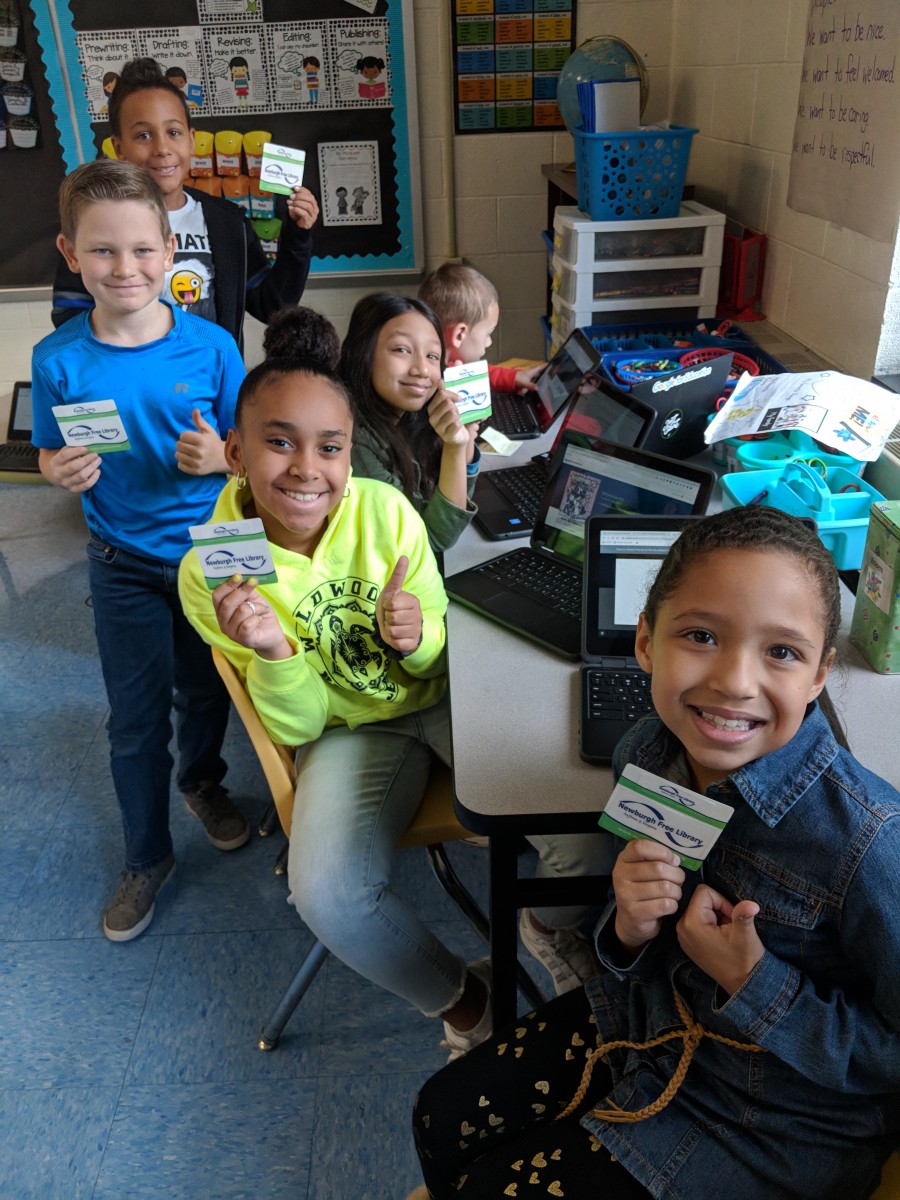 Students with their library cards.