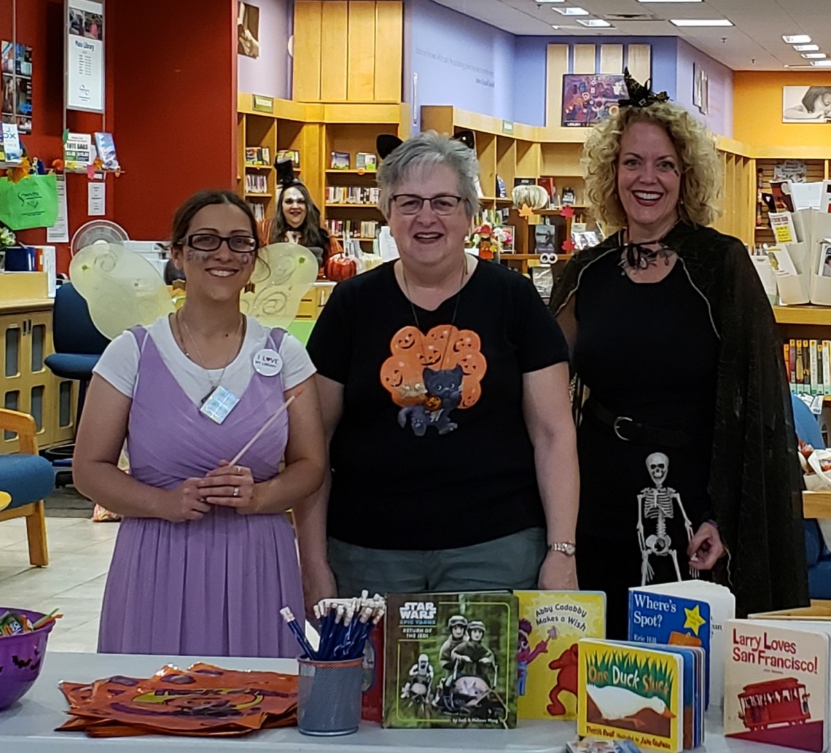 Library staff pose for a photo in their costumes.