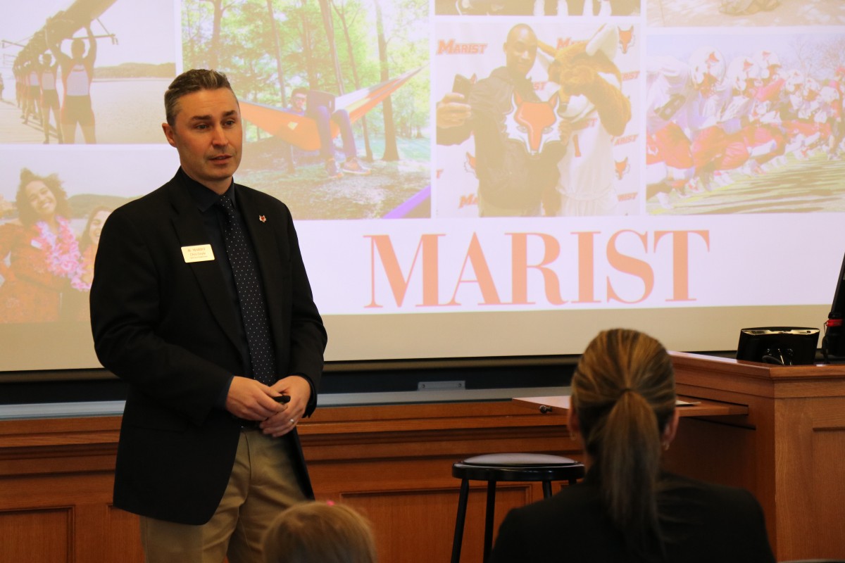 Mr. Chris Doyle, Director of Admission shares information with students.