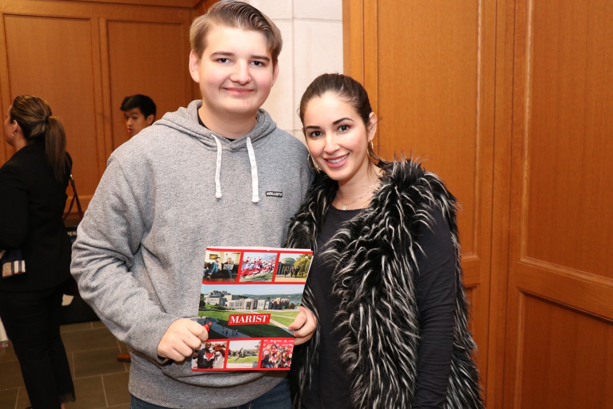 Student and parent pose for photo.