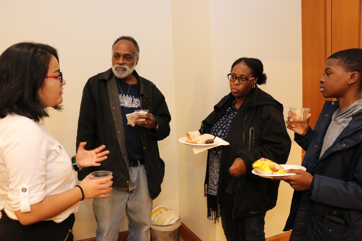 Students and their parents receive a tour of campus.