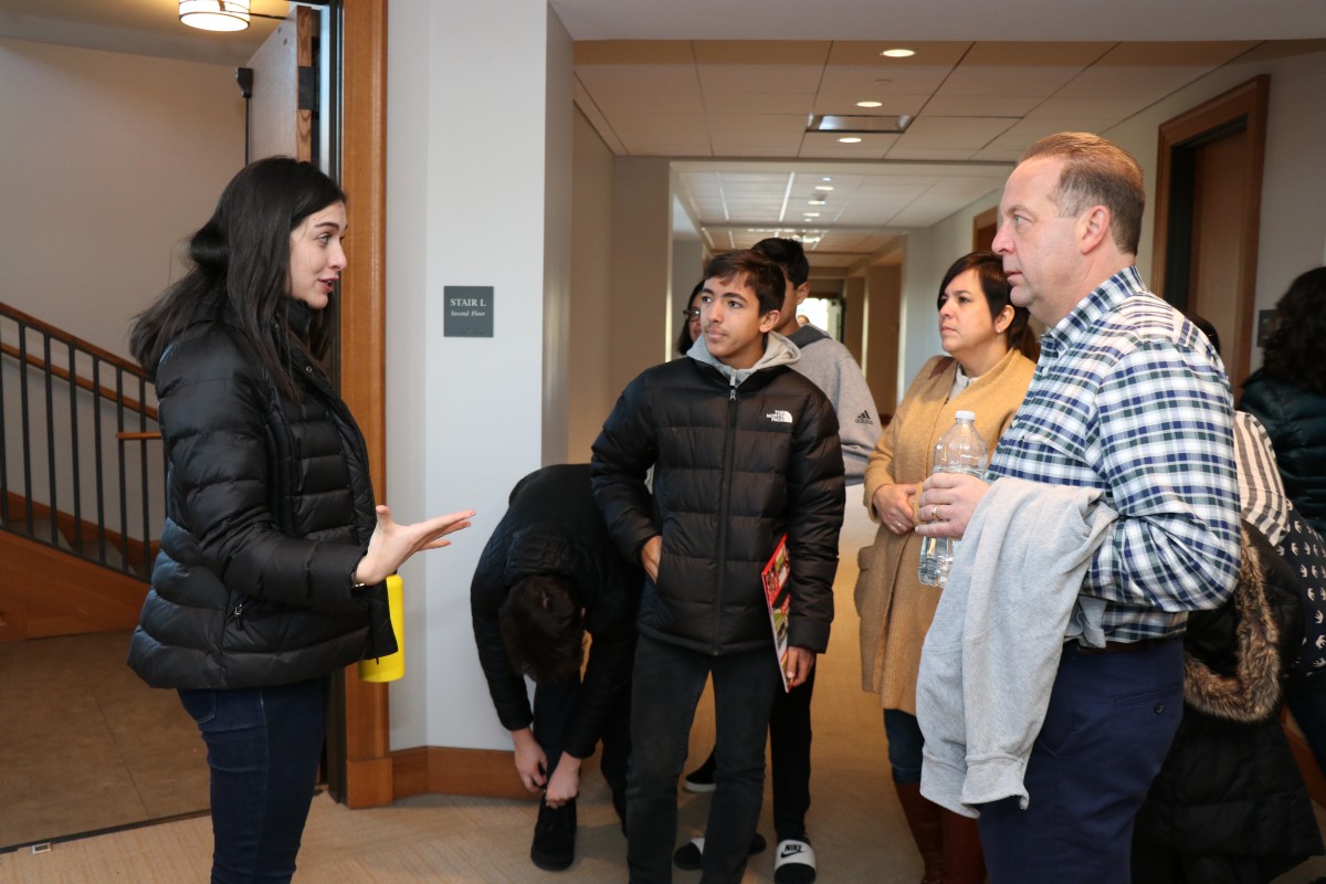 Students and their parents receive a tour of campus.