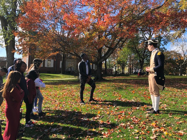 Students listen to tour guide at Washington's Headquarters.